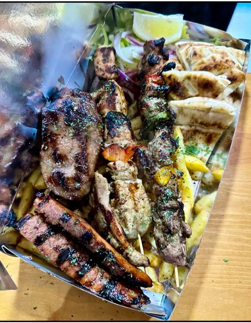 Mixed grill box: souvlaki, greek sausage, chips and warm pita bread